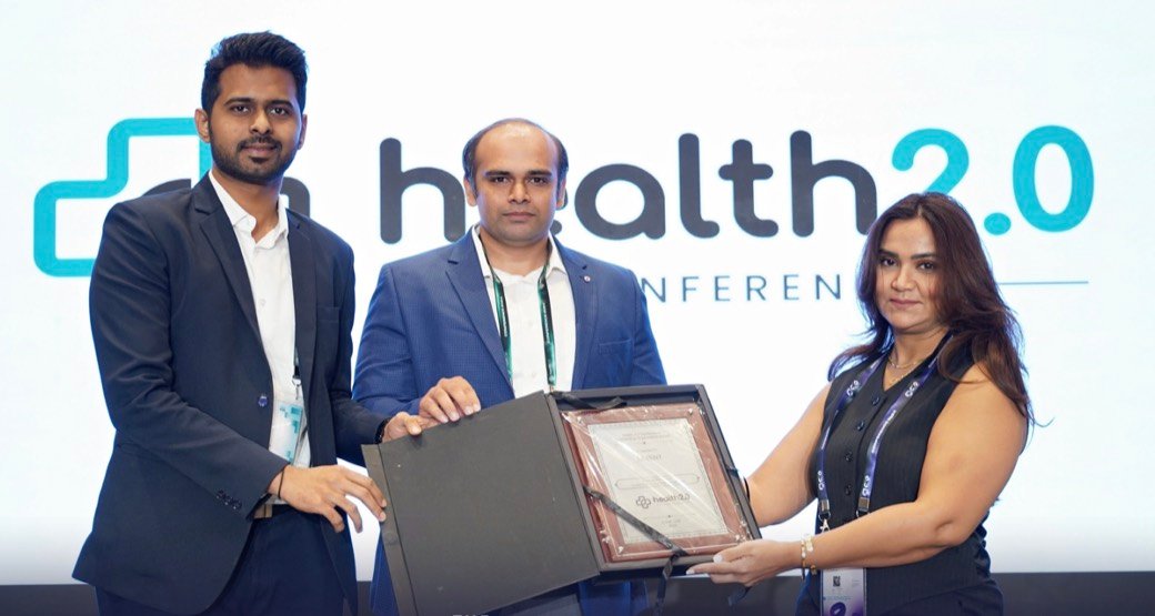 Latent receiving the Outstanding Contribution to Healthcare award at the Health 2.0 conference, December 2024